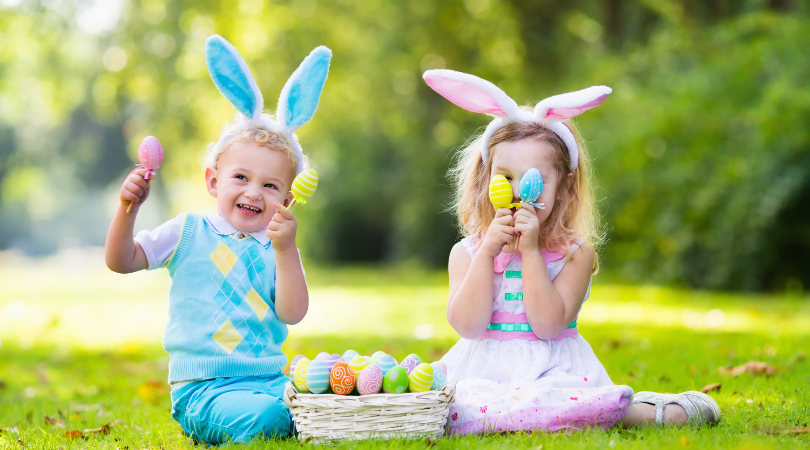 happy kids in garden on Easter with bunny ear bands
